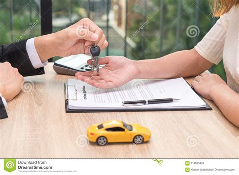 Businessman Giving Car Key Over Car Loan Application Document Wi Stock Photo - Image of compact ...