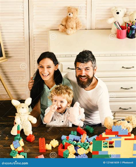 Family and Childhood. Mom, Dad and Boy Play with Toys Stock Image