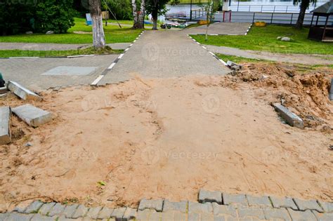 Disassembled road pavement of paving cement concrete tiles, bricks
