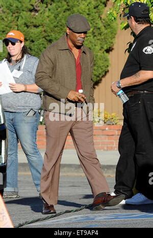 Actor Eddie Murphy sports a grey mustache and 70's attire on the set of ...