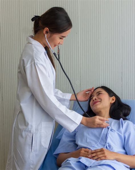 Female Doctor Checking Patient Using Stethoscope Stock Photo - Image of ...