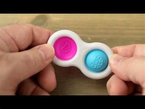 Simpl Dimpl: A fidget keychain that pops.