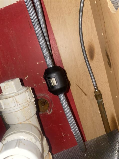 Water leaks out of this black thing that’s attached to the hose to my