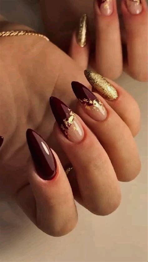 aesthetic dark red gold winter nails maroon nails gold glitter