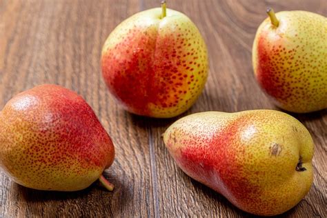 Pears-halves in caramel sauce and fresh whole. Top view - Creative ...