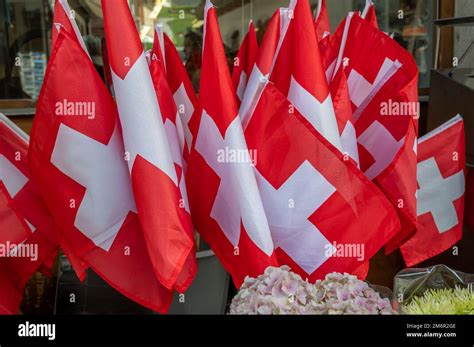 Swiss flag. Group of Switzerland flag. Red square flag with a white ...