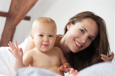 Premium Photo | Happy mother and baby waving hello