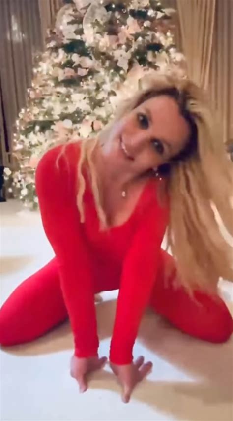 Britney Spears flips off camera, eats cake from floor amid Instagram return