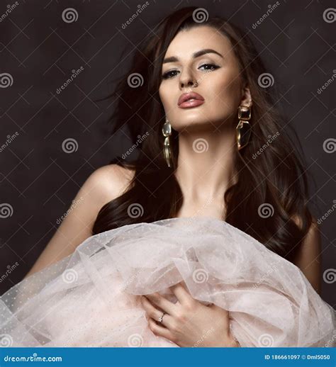 Portrait of Young Sensual Brunette Woman Posing Naked Covering Herself