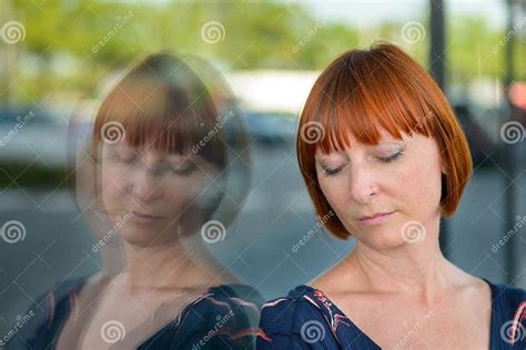 dejected woman   sad expression  downcast eyes stock image