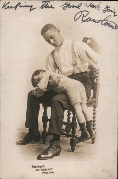 man spanks boy  knee spanking postcard