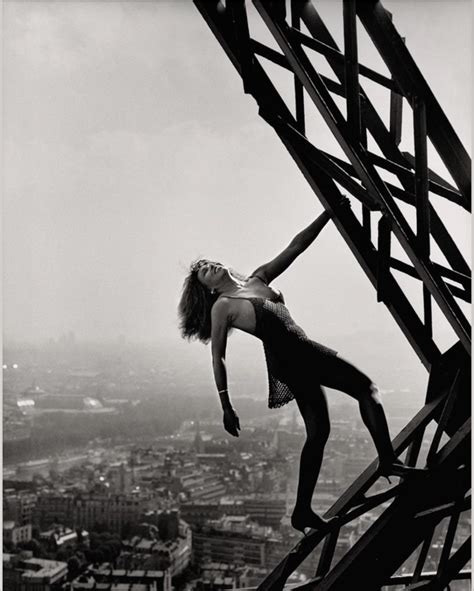 Tina Turner hanging out at the Eiffel Tower for a photo shoot (1989