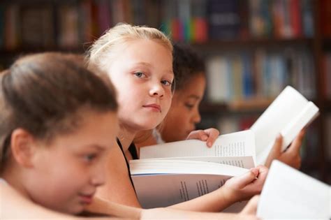 premium photo girl portrait  reading books  classroom