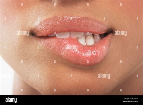 woman biting lip stock photo alamy