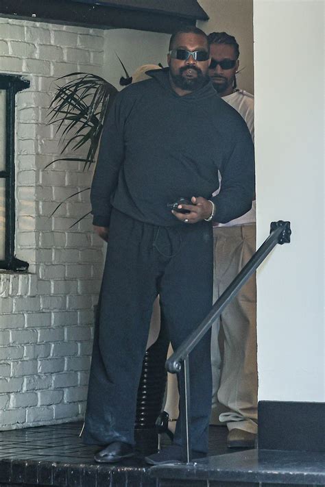 Kanye West attempts to hide wife Bianca Censori from cameras as she