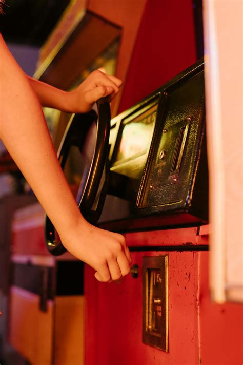 Person Playing An Arcade Machine · Free Stock Photo