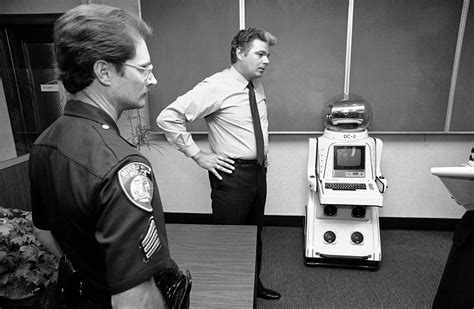 Police display a robot they had taken into custody after it was found ...