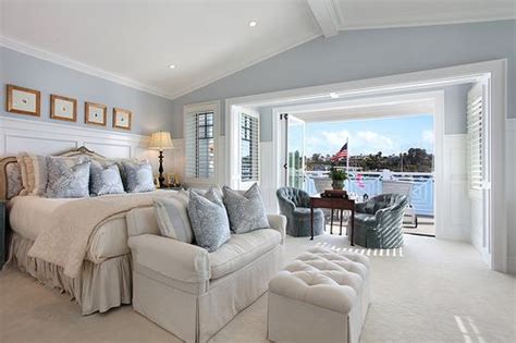 mmm comfy and cozy big white and blue bedroom overlooking the water Coastal Master Bedroom ...