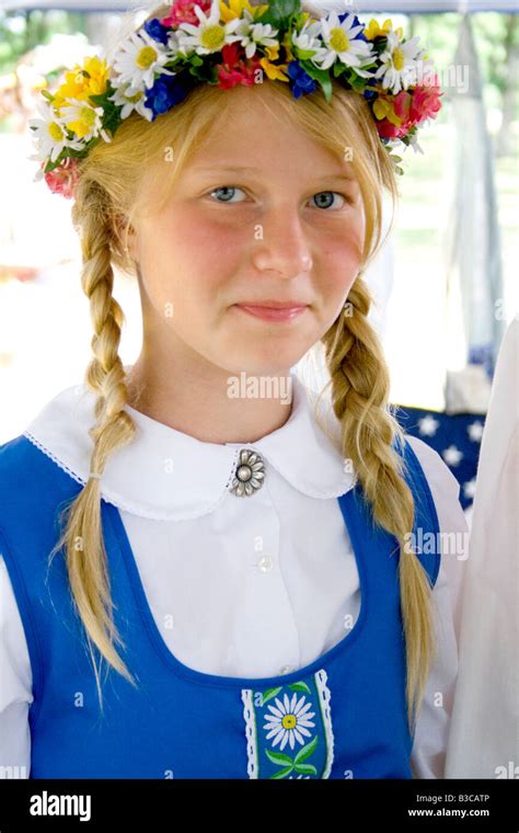 Teenager wearing garland and costume of Sweden. Svenskarnas Dag Swedish ...