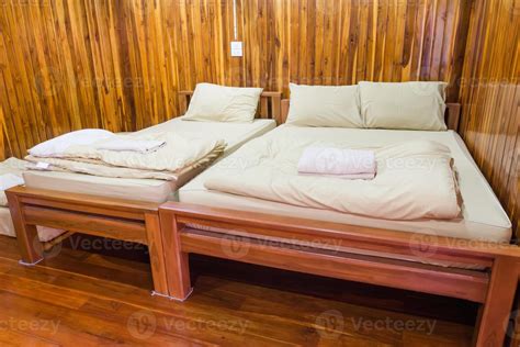 wooden bed in a wood house 10715360 Stock Photo at Vecteezy