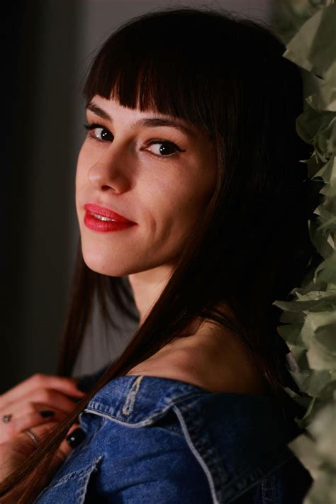 Woman Leaning Beside Wall · Free Stock Photo