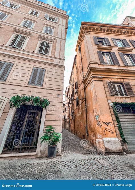 Ancient Roman Buildings with Cobblestone Alley and Greenery in Rome