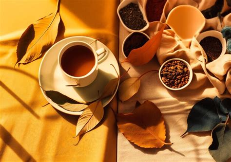 Premium Photo | A cup of tea and leaves on a yellow background