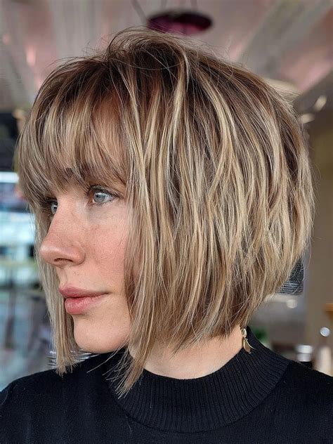 Fashion critics debate if the long layered bob haircut with bangs is timeless