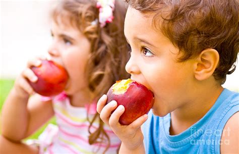 happy children eating apple photograph  anna om fine art america