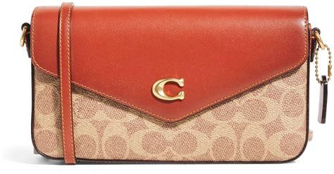 coach canvas wyn cross body bag  red lyst