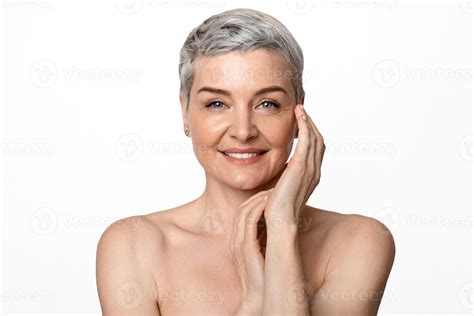 Aged Beauty. Portrait of attractive nude mature lady with smooth skin