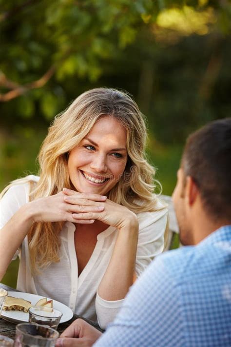 Happy, Couple and Eating Dinner in Garden Outdoors at Table Together