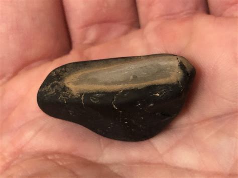 smooth shiny black rock  tangrey interior int   scratched