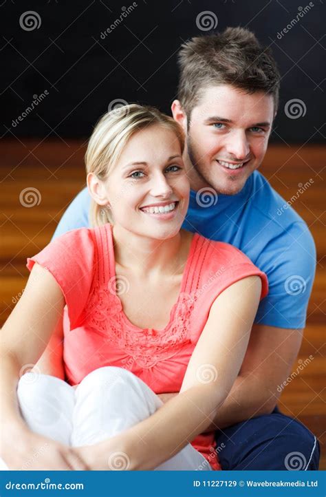 lovers sitting    floor  smiling stock image image