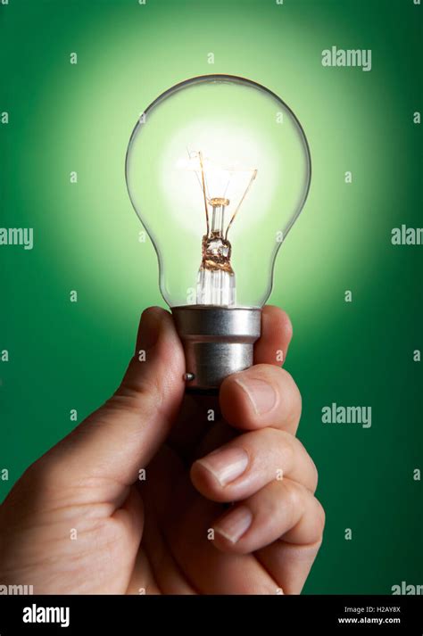 Green light bulb Stock Photo - Alamy