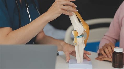 Human cruciate ligament injury treatment concept. Orthopedist showing ...