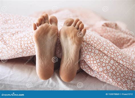 Feet girls under a blanket stock image. Image of lifestyle - 153078869