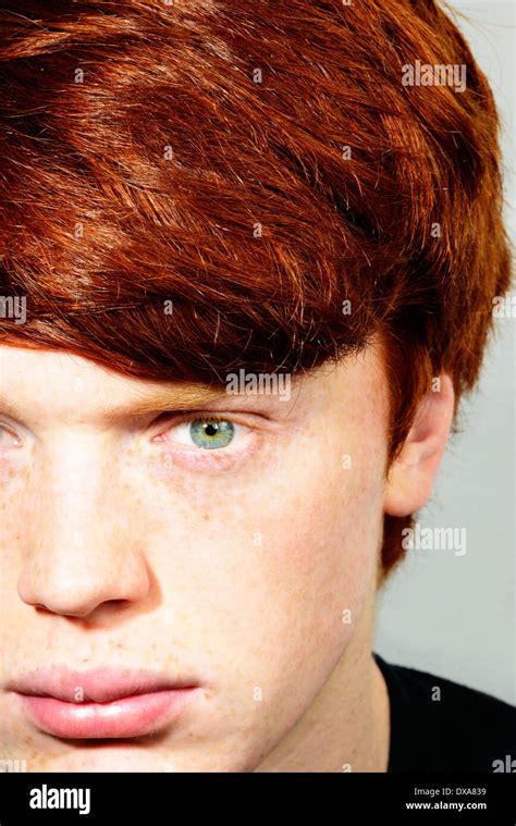 Young man with red hair, freckles and green eyes Stock Photo - Alamy