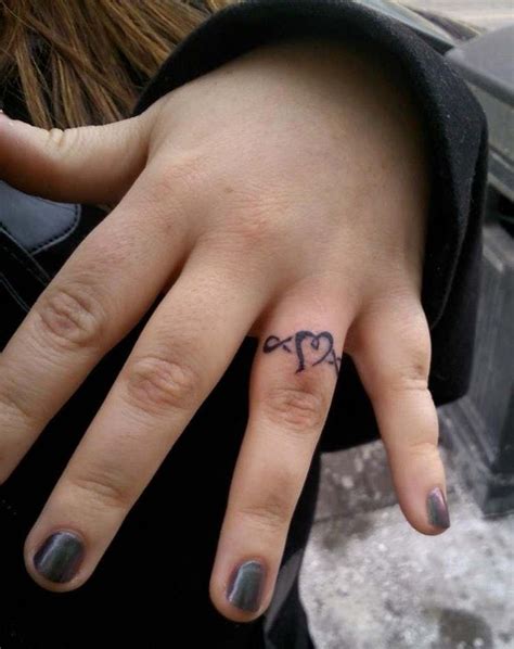 Ring Tattoo Ideas | Ring tattoo designs, Ring finger tattoos, Heart ...