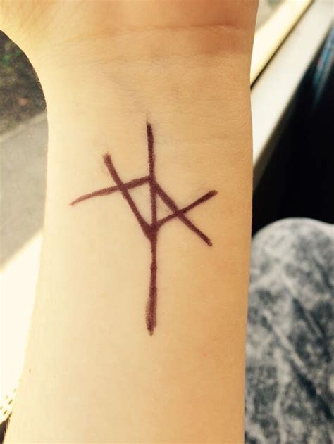 The evil within symbol | Small tattoos for guys, Symbolic tattoos ...