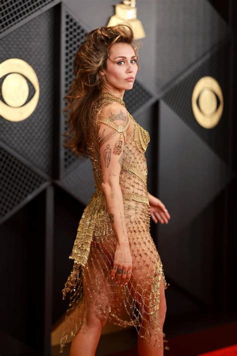 Miley Cyrus Wore a Completely Sheer, Gold Netted Dress to the 2024 Grammys