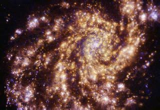 Newborn stars set 'grand design' spiral galaxy aglow in stunning new ...