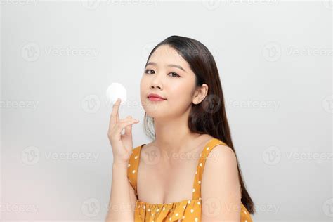 Photo of a beautiful young pretty asian woman with healthy skin posing