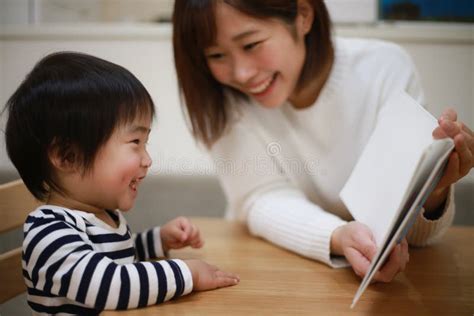 Parent and child reading stock photo. Image of person - 241908584