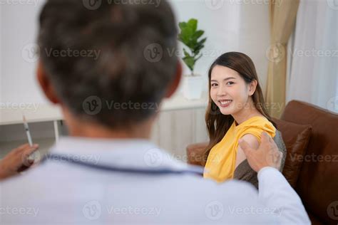 Obstetrician gynecologist and vaccination needle or pregnant woman