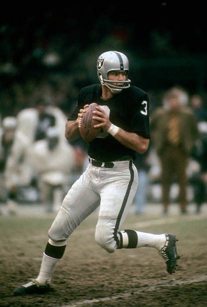 Quarterback Daryle Lamonica of the Oakland Raiders drops back to pass ...