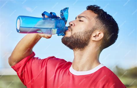 premium photo man soccer  hydration drinking water  sports