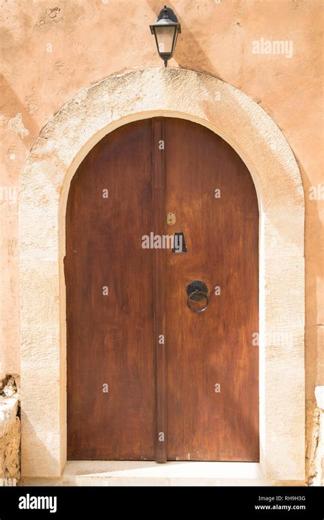 Arched wooden door Stock Photo - Alamy