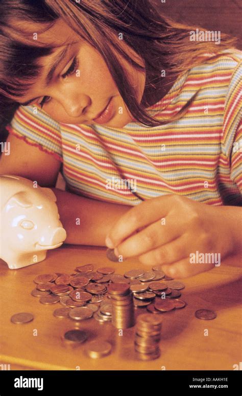 young girl counting money stock photo alamy