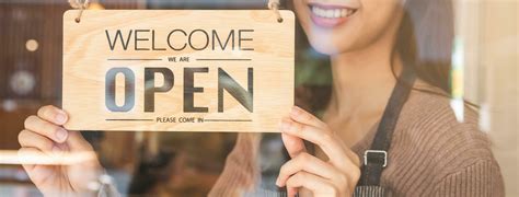 Smiling young asian woman owner, employee retail coffee shop woman hand